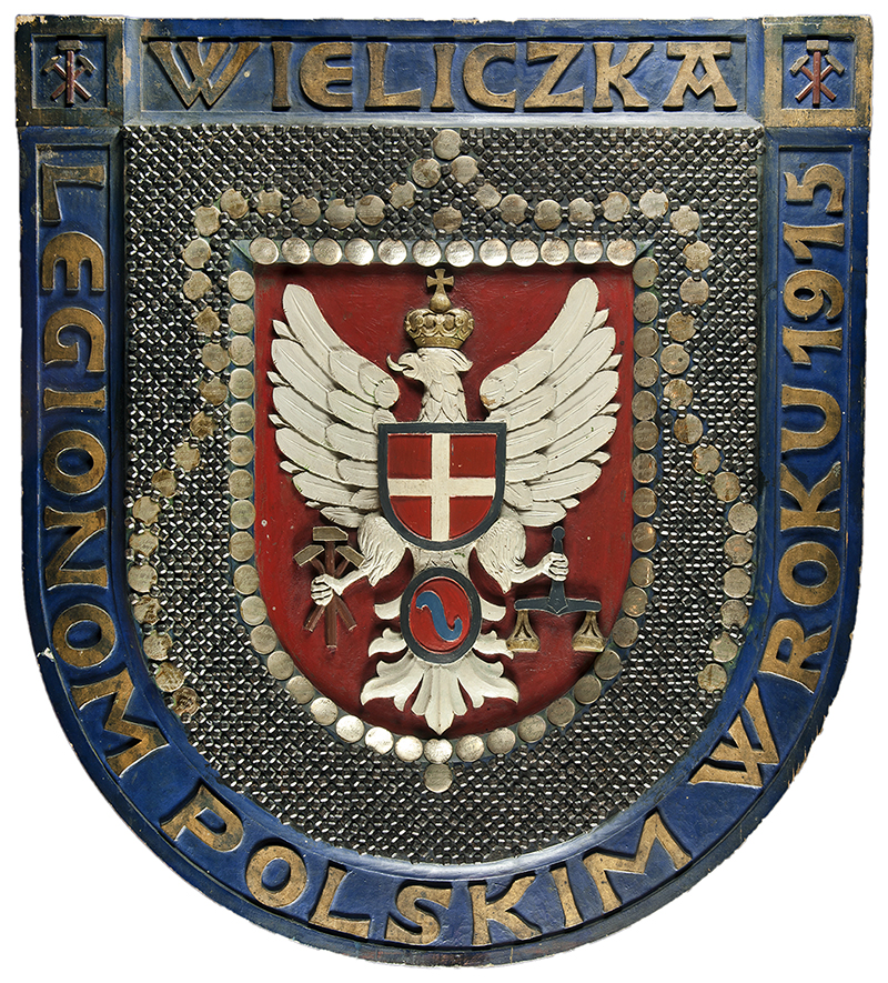 Tarcza Legionów z 1915 r. ufundowana przez Wieliczkę i powiat wielicki, gdzie każdy obywatel mógł wbić gwóźdź, wpłaciwszy wcześniej odpowiednia kwotę na ten fundusz Muzeum Żup Krakowskich Wieliczka, Zbiory Sztuki, nr inw. IV/100