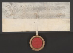 Zygmunt król polski po&nbsp;śmierci burgrabiego krakowskiego i&nbsp;sekretarza Bony Ludwika Alphiusa nadaje dom burgrabiów krakowskich królowej Bonie; po&nbsp;jej śmierci odziedziczy go Zygmunt August. Kraków, 5 lipca 1543 roku. Pergamin; j. łaciński; wymiary 46,6 × 20,2 × 9 cm; pieczęć większa koronna w&nbsp;czerwonym wosku na&nbsp;pergaminowym pasku; podpis króla. ANK, Zbiór Rusieckich, sygn. 29/683/213 